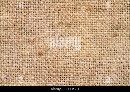 Die Textur von rauer natürlicher Sackleinen. Oberfläche von grobem Stoff. Stockfoto