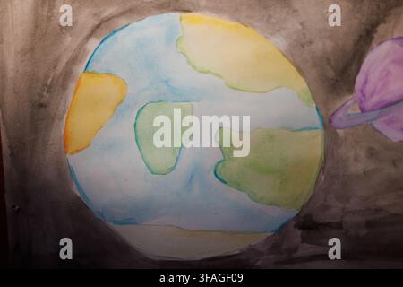 Kinder-Aquarellmalerei des Planeten Erde auf weißem Papier Stockfoto