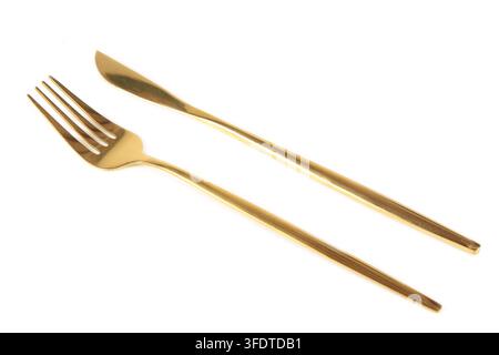 Goldene Gabel und Messer isoliert auf weißem Hintergrund Stockfoto