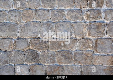 Alte mittelalterliche Steinmauer zur Verwendung als Hintergrundtextur Stockfoto