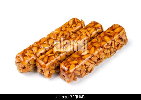 Kozinaki auf weißem Hintergrund. Süßwaren aus Samen. Süße Kozinaki. Stockfoto