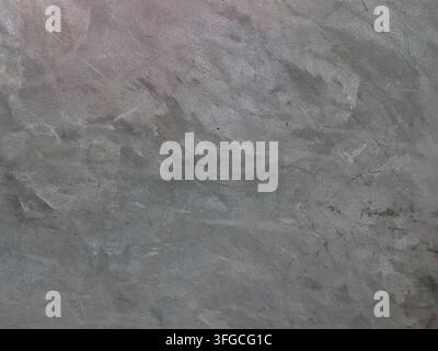 Graue polierte Betonwandtextur mit natürlichen verwitterten Mustern, ideal für industrielle, grunge und minimalistische Hintergründe. Stockfoto