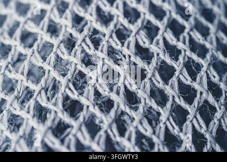 Extrem makroskopische Ansicht von Nylon-Textilfasern mit detaillierter gewebter Struktur und Oberflächentextur. Synthetisches Fasermaterial mit feinen Fäden und komplizierten Mustern Stockfoto