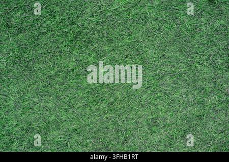 Überkopf-Hintergrundtextur in voller Bildfläche von grünem Kunstrasen-Teppich. Stockfoto