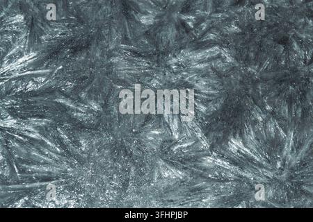 Abstrakte scharfe Makrotextur mit kalten blau-grauen Metalltönen Stockfoto