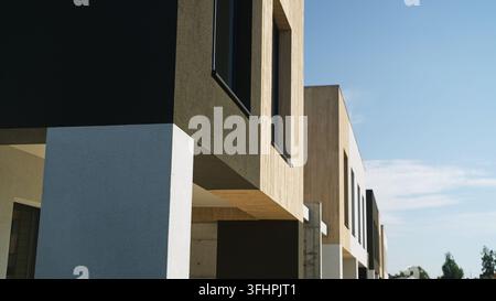 Außenfassaden von Wohngebäuden, die neue Bauweisen mit einer Mischung aus Holz, Putz und großen Fenstern präsentieren Stockfoto