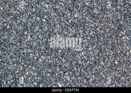 Opfsichtstextur von feinem grauem Brecherstein-Gravel. Stockfoto