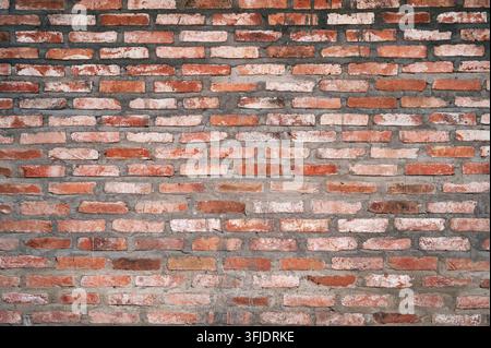 Roter Backsteinhintergrund. Die Textur der roten Ziegelsteinmauer. Stockfoto