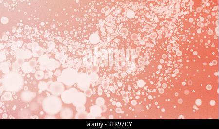 Ein abstrakter Korallenhintergrund mit zarten Bokeh-Effekten und schwebenden Blasen, der ein sanftes, elegantes Bild erzeugt. Stockfoto