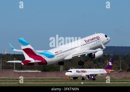 25.09.2026, xsvx, Reise, Urlaub, Wirtschaft, emwir, D-AENH, Airbus A320-251N A320neo, Baujahr: 2022, Eurowings Lufthansa Group, Deutschland, Hex Code: 3C55C8, MSN: 11125, Besonderheit: makechangefly-Sticker, seit Februar 2023 bei Eurowings, Indienststellung am 16. März 2023. Start in Stuttgart. Abflug Im Hintergrund SU-BUT, Airbus A320-251N A320neo, Baujahr: 2022, Air Cairo, Ägypten, Hex Code: 01023C, MSN: 11205, Besonderheit: zeitweise Misr Life Insurance-Sticker 2023 und 20 Years-Sticker ab November 2023. Stuttgart *** 25. September 2026, xsvx, Reise, Urlaub, Wirtschaft, emwir, D AENH, Air Stockfoto