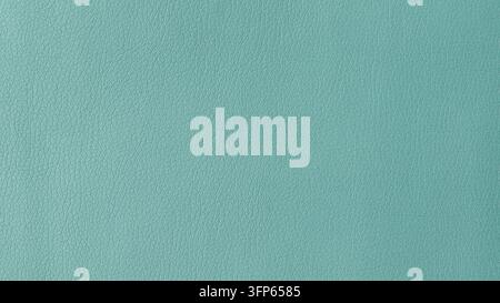 Hochwertiges Blaues Makrobild von Kunstleder in einer zarten hellgrünen Farbe. Das Material hat eine subtile poröse Struktur, ideal für die Visualisierung Stockfoto