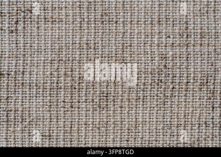 Natürliche Vintage-Leinentextur als Hintergrund, Makro. Helle cremefarbene Leinenstruktur, alte rustikale Leinwand. Draufsicht, Nahaufnahme Stockfoto