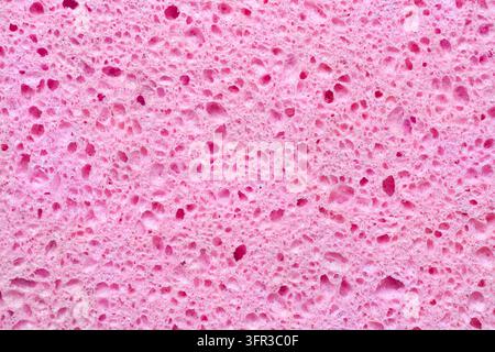 Die Textur eines rosa porösen Materials. Rosa weiches Material im Nahaufnahme. Stockfoto