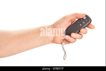 Fan-Fernbedienung in der Hand, Pfad isoliert auf Weiß Stockfoto