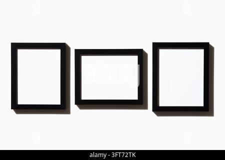 Drei schwarze Bilderrahmen auf weißem Hintergrund Stockfoto