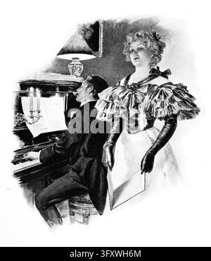 Paar macht Musik am Klavier — Frau in einem eleganten Abendkleid mit langen Handschuhen singt, während ein Mann in einem Frack sie auf einem aufrecht stehenden Klavier begleitet Stockfoto
