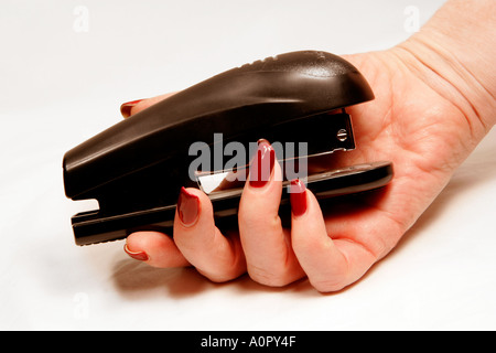 Hefter in der hand Stockfoto