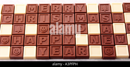 FROHE WEIHNACHTEN UND HAPPY NEW YEAR-PRALINEN Stockfoto