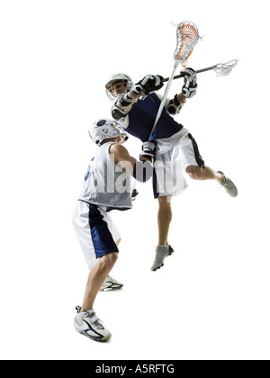 Zwei junge Männer spielen lacrosse Stockfoto