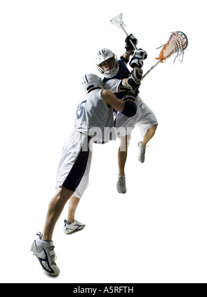 Zwei junge Männer spielen lacrosse Stockfoto