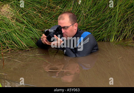 Fotograf fotografiere die jährliche Mountain Bike Bog Schnorcheln Championships bei Llanwrtyd Wells Powys Wales UK Stockfoto