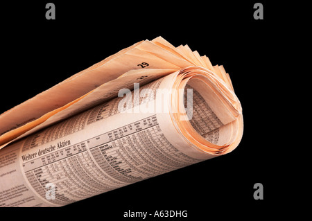 Vergilbte Zeitung aufgerollt Stockfoto