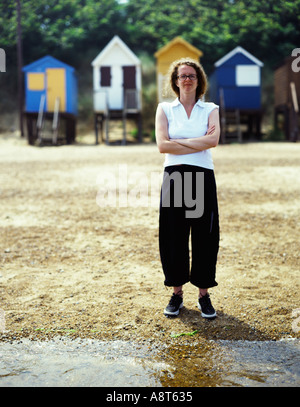 britische Strand Hütte Frau Brunnen nächste Meer Urlaub Großbritannien Stockfoto