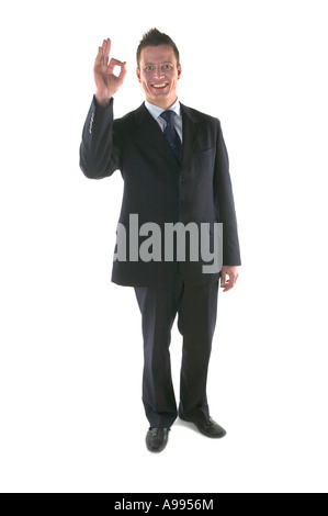 Geschäftsmann, Lächeln und Gestikulieren, dass alles ist in Ordnung, die isoliert auf weiss Stockfoto