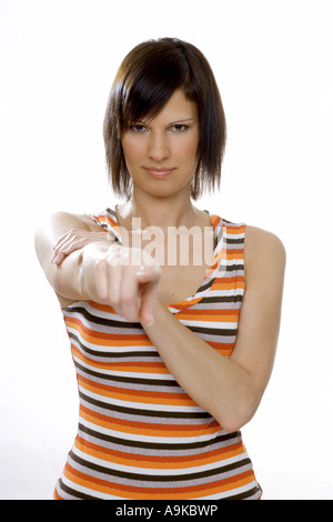 junge Frau zeigte mit dem Zeigefinger Stockfoto