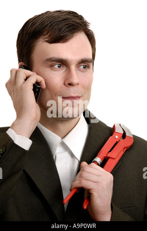 Geschäftsmann mit Schraubenschlüssel Gespräch per Handy Mann mobile Techniker Mechaniker Klempner Handwerker-Betrieb Stockfoto