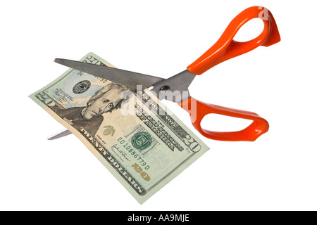 Schere schneiden zwanzig Dollarnote Stockfoto