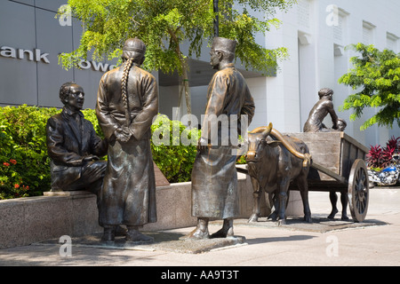 Fluss Kaufleute Bronze-Skulptur von Aw t Hong am Ufer Boat Quay Bereich zentrale Naturschutzgebiet Singapur Stockfoto