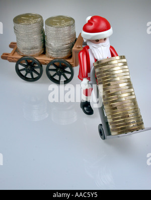 Santa Claus bringt Geld Stockfoto