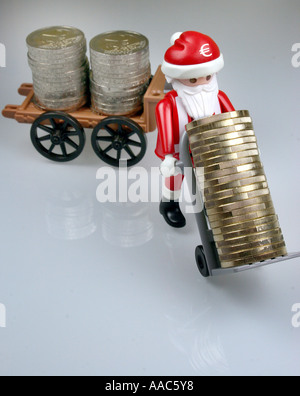 Santa Claus bringt Geld Stockfoto