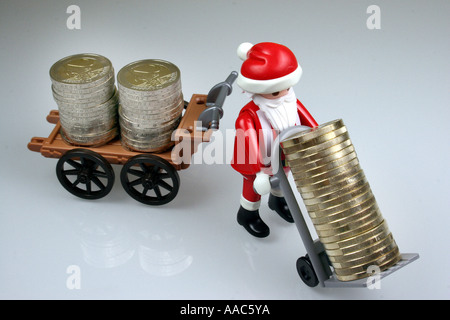 Santa Claus bringt Geld Stockfoto