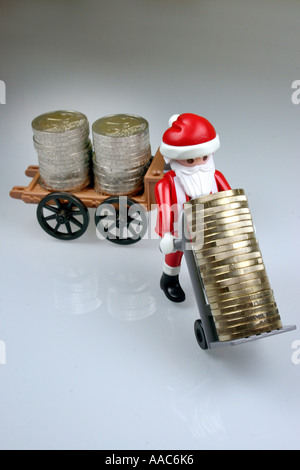 Santa Claus bringt Geld Stockfoto