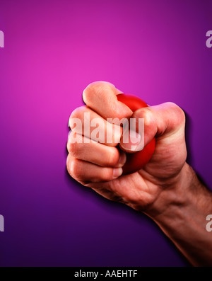 Hand drückte rot Stress-ball Stockfoto