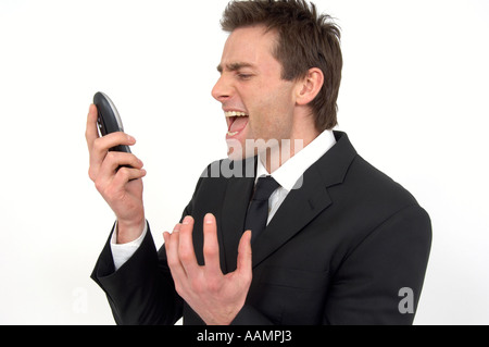 Menschen schreien nach unten am Telefon Stockfoto