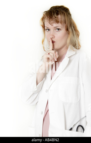 Ärztin mit Finger vor den Lippen Stockfoto
