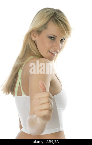 blonde Frau, die Daumen hochhalten. Stockfoto