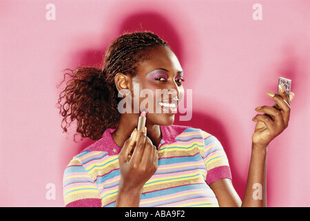 Frau Make-up anziehen Stockfoto