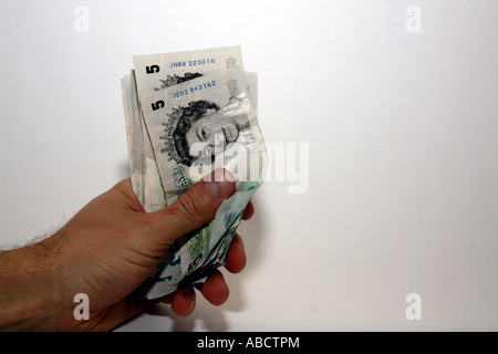 Mann mit fünf-Pfund-Noten Stockfoto