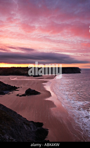Sonnenuntergang über drei Klippen Bucht Gower South Wales UK Stockfoto