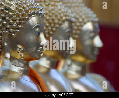 Reihe von drei goldenen buddhas Stockfoto