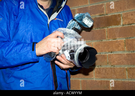 Fotograf im Regen. Stockfoto