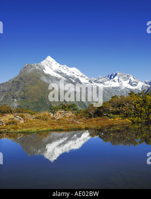 Key Summit mit Spiegelbild des Mt. Christina, Neuseeland, Südinsel, Fjordland Nationalpark Stockfoto