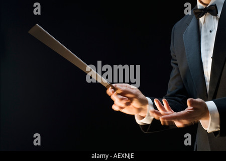 Die Hände der Dirigent eines Orchesters Stockfoto