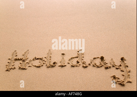 Urlaub handschriftlich in goldenem Sand viel Textfreiraum Stockfoto