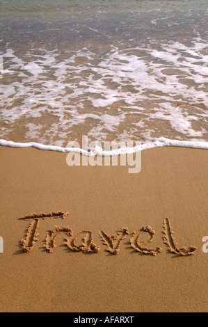 Reisen in den Sand am Strand geschrieben Stockfoto