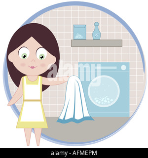 Frau hält ein Handtuch vor einer Waschmaschine Stockfoto
